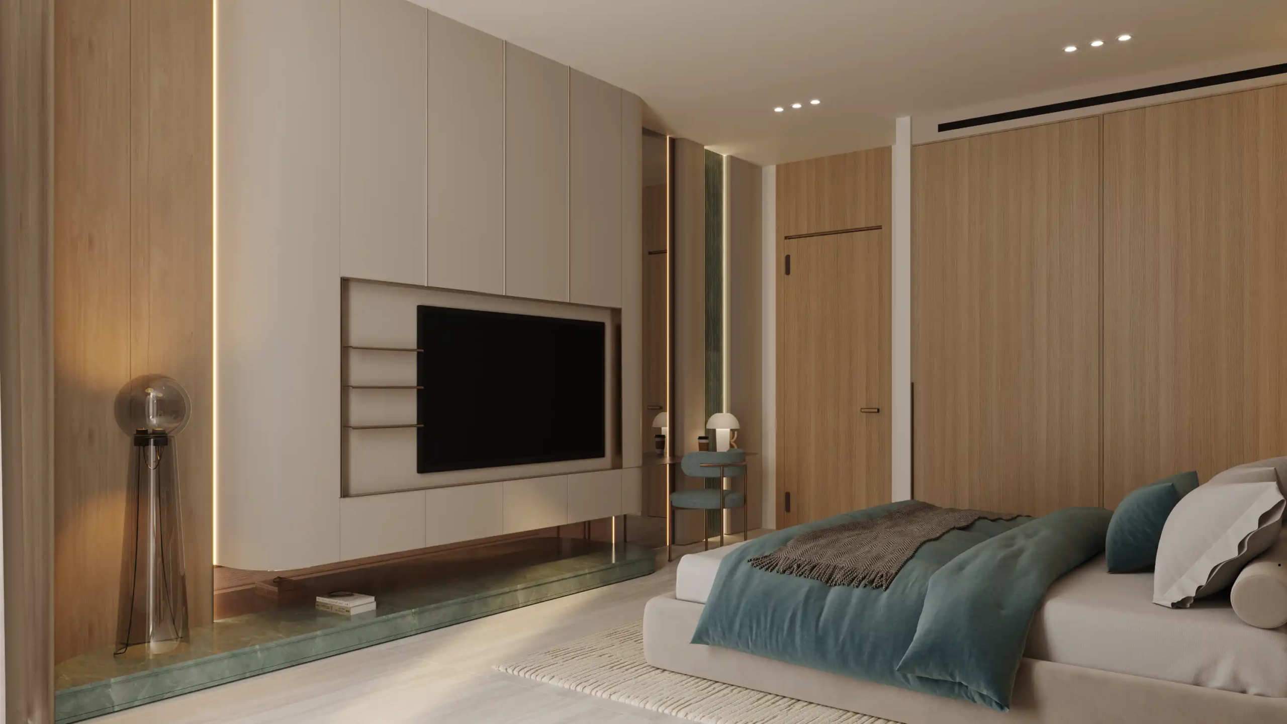 Minimalist modern bedroom at Binghatti Aquarise featuring a large wall-mounted TV, wood-paneled walls, a low bed with teal and gray bedding, a small side table, a decorative lamp, and soft ambient lighting.