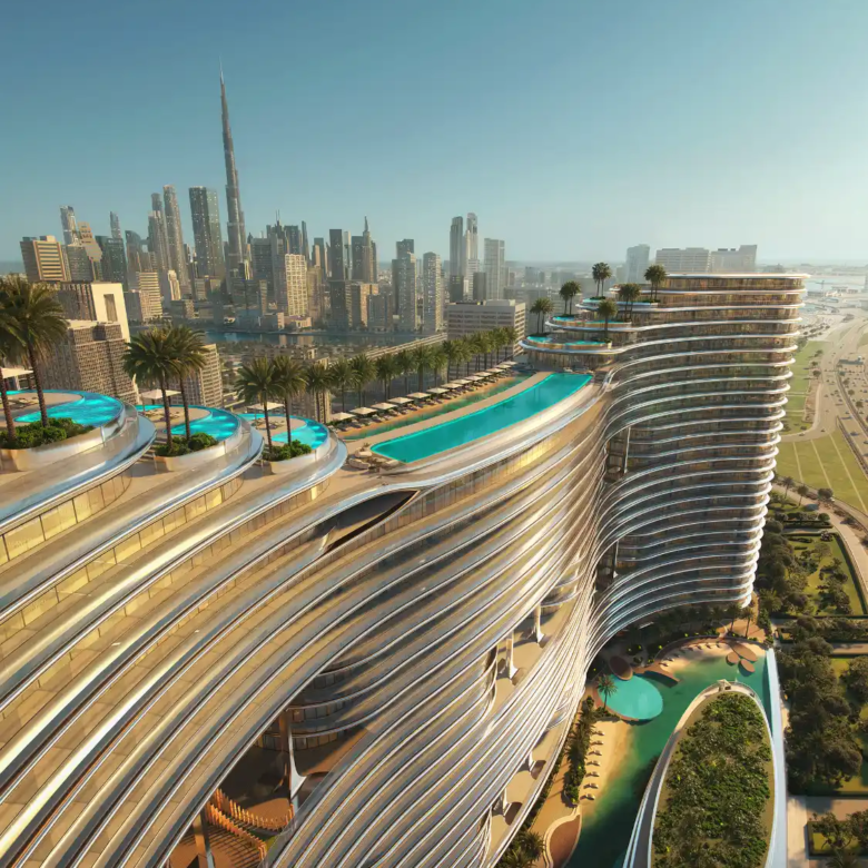 A futuristic skyscraper, Binghatti Aquarise, with curved, layered architecture features rooftop infinity pools and lush greenery, overlooking a city skyline with the Burj Khalifa in the background under a clear blue sky.