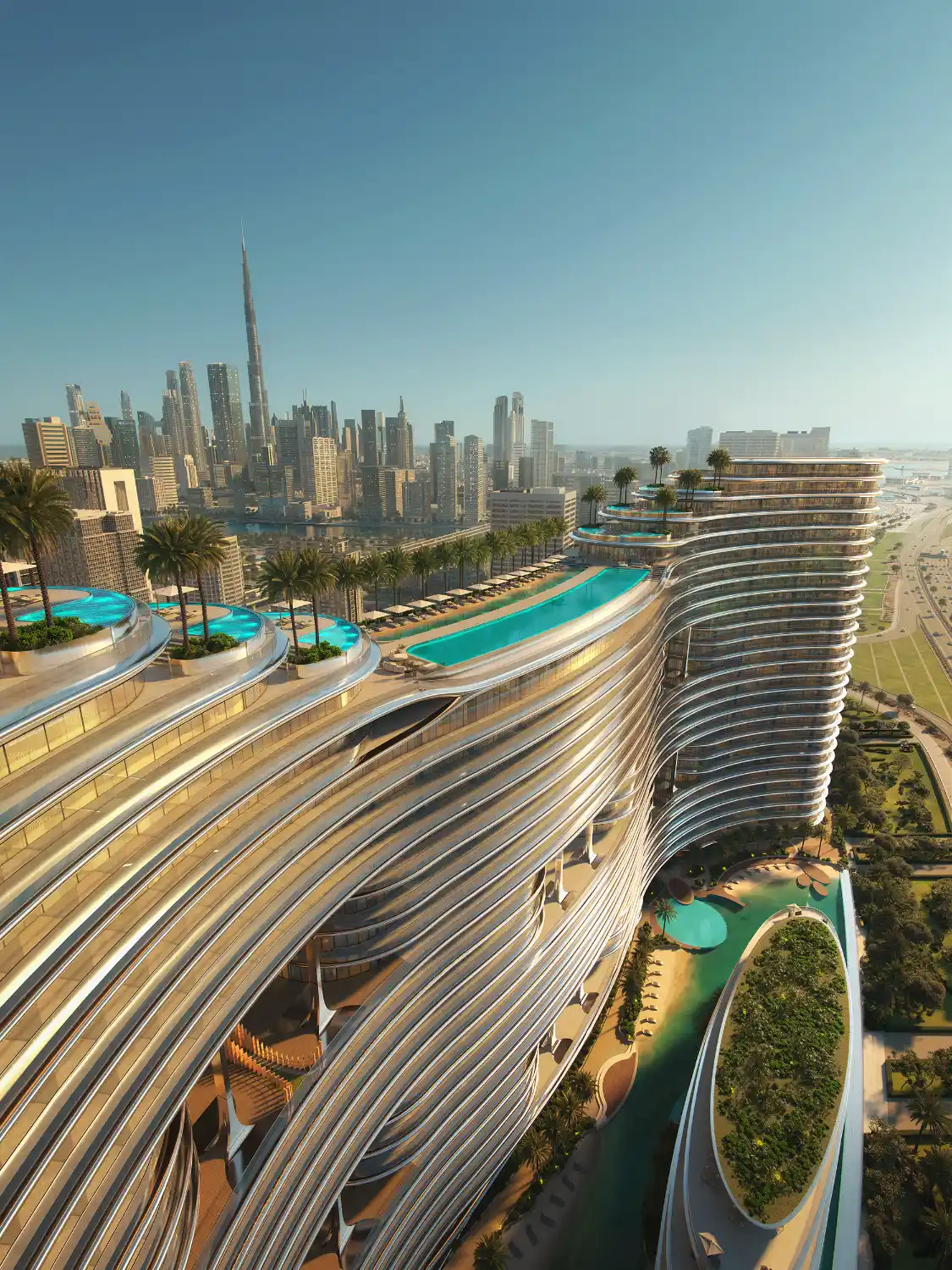 A futuristic skyscraper, Binghatti Aquarise, with curved, layered architecture features rooftop infinity pools and lush greenery, overlooking a city skyline with the Burj Khalifa in the background under a clear blue sky.