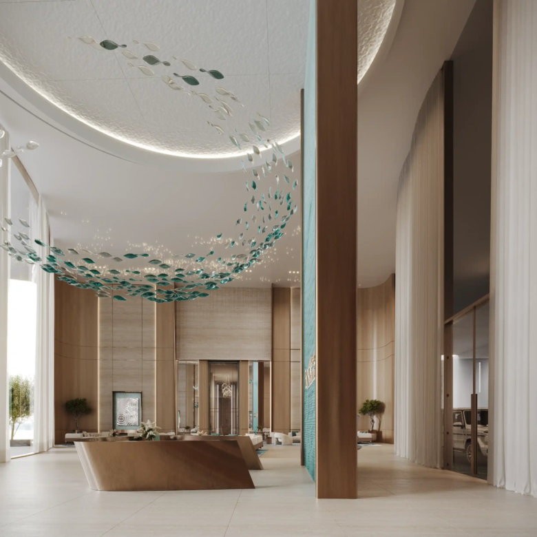 Spacious modern lobby with curved wooden walls, sheer curtains, and a sculptural wooden reception desk welcomes you at Binghatti Aquarise. A decorative ceiling installation and natural light streaming through large windows create a vibrant atmosphere.
