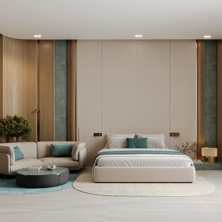 Modern bedroom at Binghatti Aquarise with a large beige bed, gray and beige sofa with teal pillows, circular rugs, and floor-to-ceiling windows. Wood paneling, soft lighting, and minimalist decor complete the serene atmosphere.